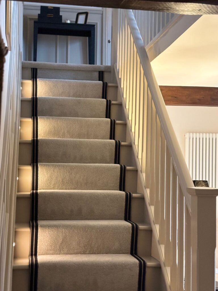 First Impression Carpet with lights within the stairs.