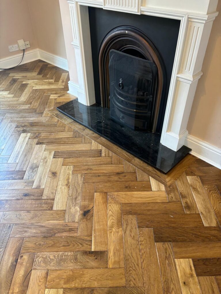 Room with Herringbone wood flooring installed.