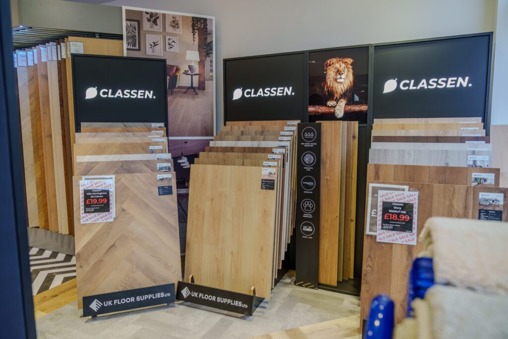 Classen stands at Jim's carpets