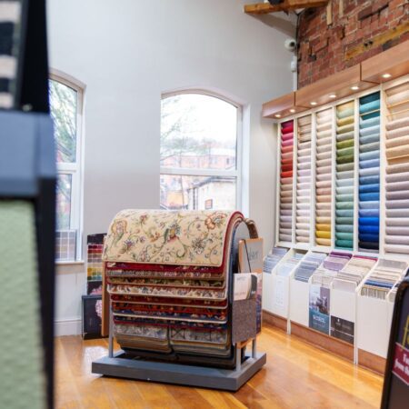 Rugs stand upstairs in Jim's Carpets